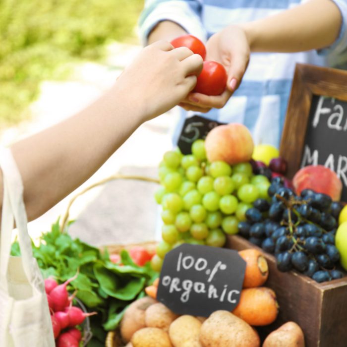 Woman buying products at farmer’s market Woman buying products at farmer's market